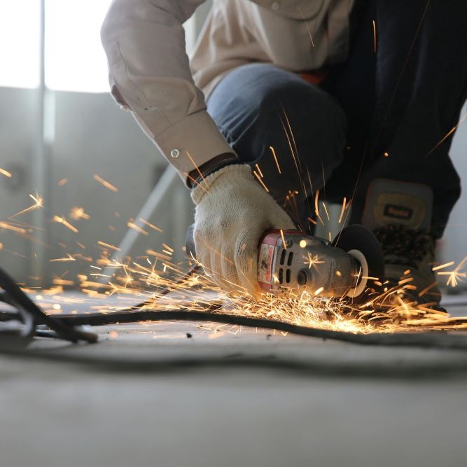 Person welding metal