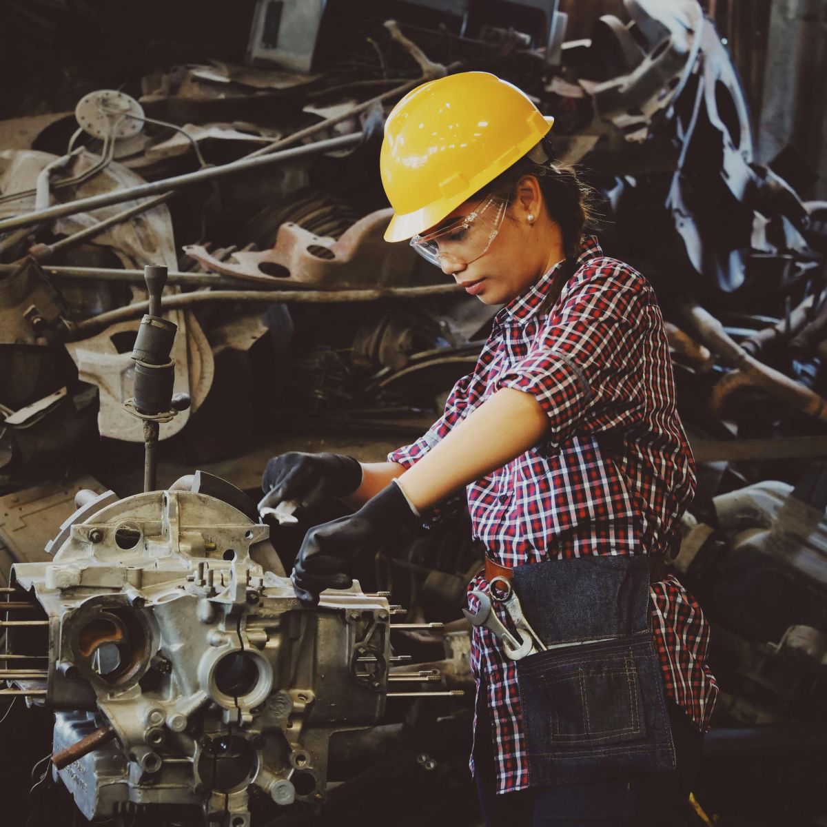 Woman fixing a machine